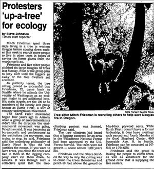 A newspaper clipping with a blurry image of a man sitting in a tree 